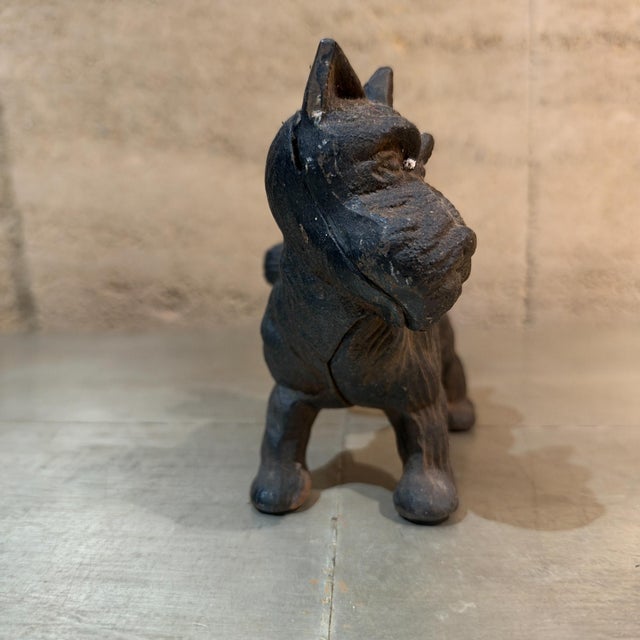 For your consideration, a cast iron Scottish Terrier or Scottie dog figurine, often used as a paperweight, bookend, or...