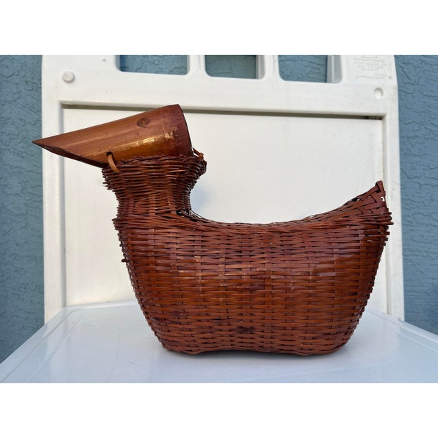 Vintage Wicker Duck or bird with Bamboo Wood Beak Sculpture. Measures 16 inches long about 6 1/2 wide and 11 inches tall ....