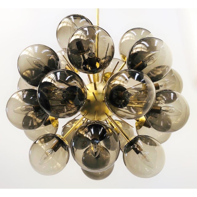 Italian sputnik chandelier with 24 smoky Murano glass globes mounted on brass frame in unlacquered natural brass finish /...