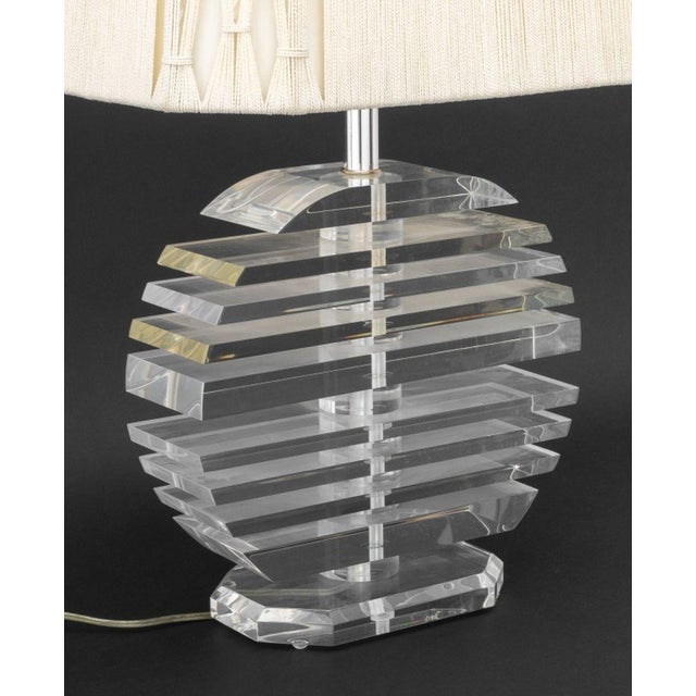 George Bullio Stacked Lucite Table Lamp, with cream colored shade and square finial, on hexagonal lucite base. 30" H x 17"...