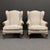 Set of three mid-20th century armchairs, with finely carved solid walnut legs and armrest details, padding completely...