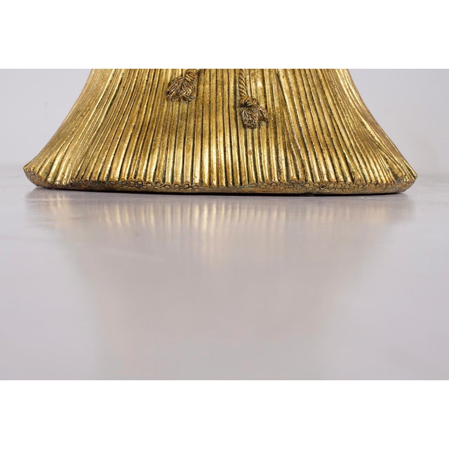"Sheaf of Wheat" coffee table in gilt molding and smoked glass, Hollywood Regency style, 1970s, Italy. The table has been...