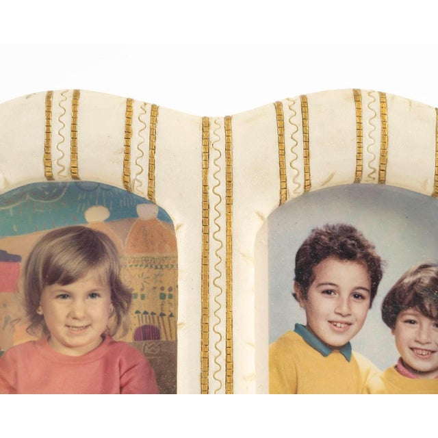 Resin photo frame for two photos from the 1960s. H: 15,5cm, W: 20cm, D: 2cm Wear consistent with age and use.