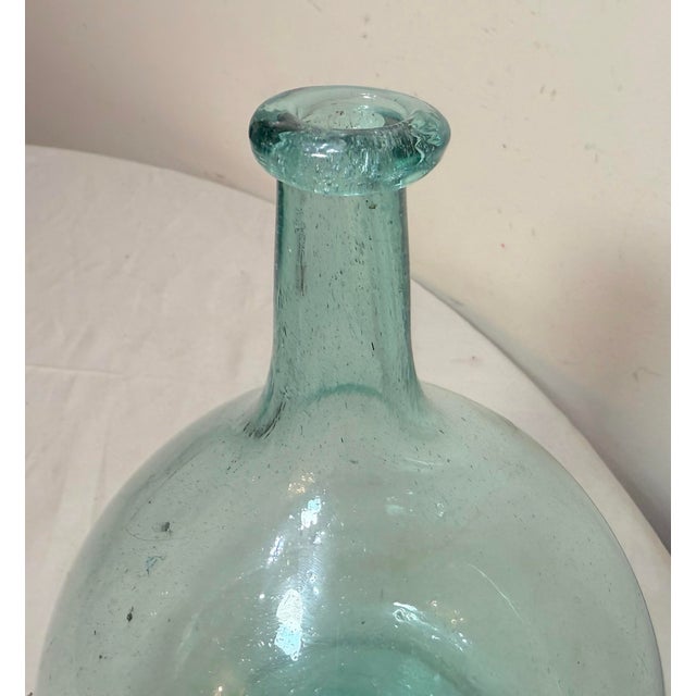 The Antique 1797-1830 Gallatin-Kramer Glassworks hand blown bulbous style bottle is a rare and collectible piece of...