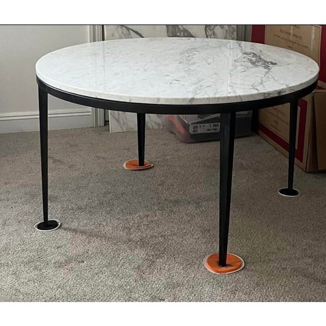 52” round custom made table. Marble top and blackened steel base. Good condition. Very heavy.