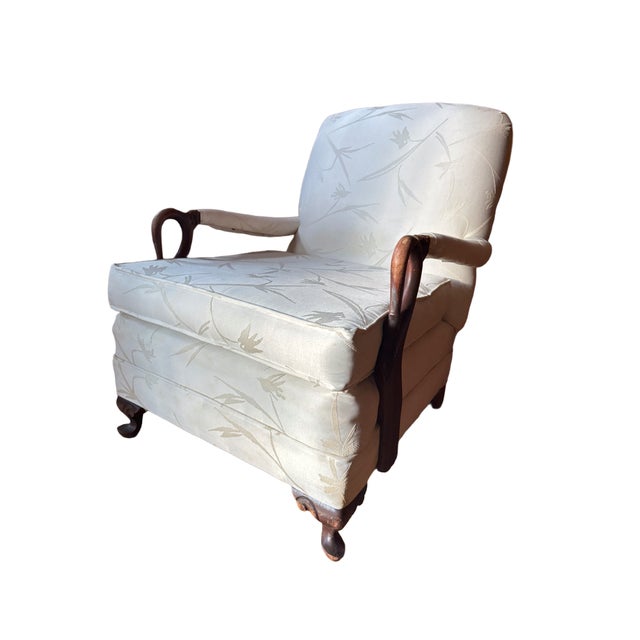 Vintage French Empire–style Bergere armchair, produced mid-20th century. The exposed wood frame features carved swan-head...
