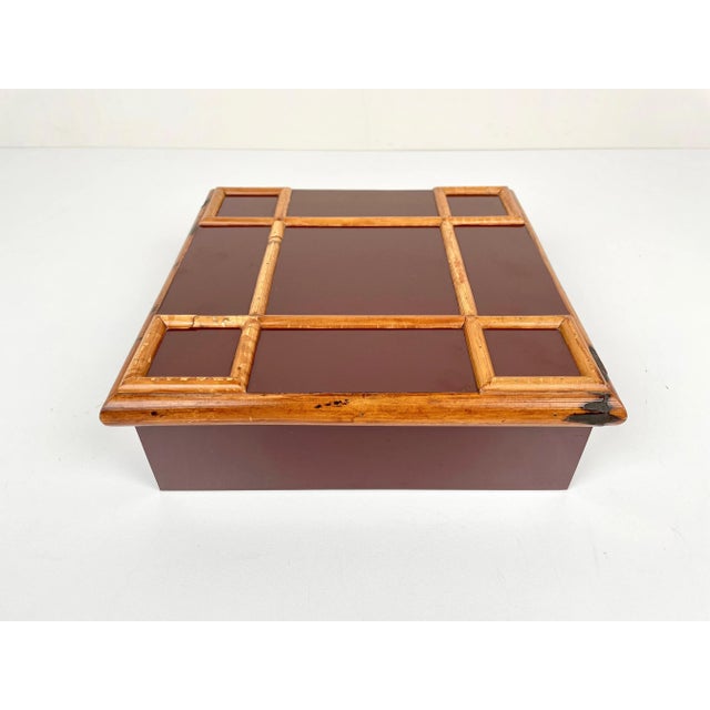 1960s squared burgundy box made of bamboo and wood by the Italian designer Tommaso Barbi. It comes with its original label...