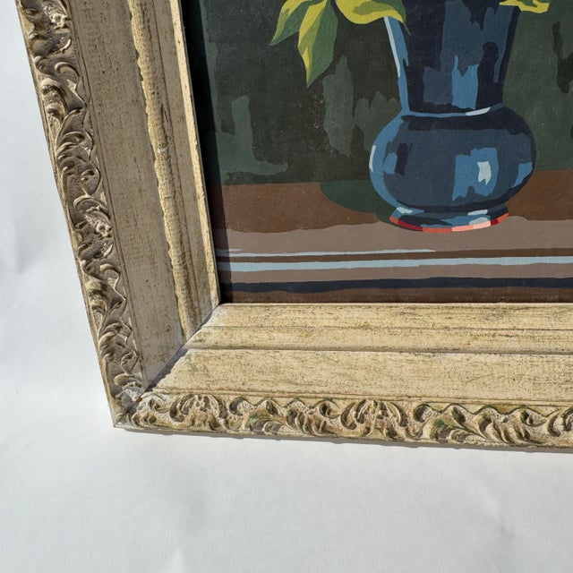 Hand painted artwork that appears to be a paint by number piece of art. Unsigned. Framed in a lovely wooden frame that has...