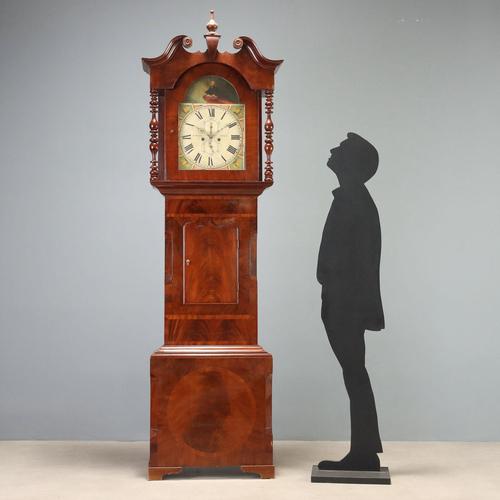 Mahogany and mahogany feather longcase clock attributed to the Jas Wharrie Otley manufacture, dating to mid-19th century...