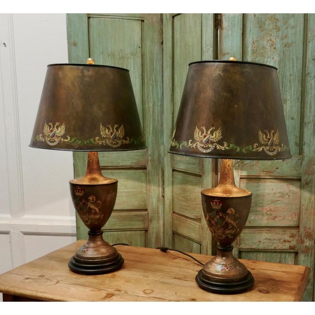 A Pair of Large Bronze Coloured Toleware Table Lamps These Large Stunning Lamps have an Armorial Crest theme they have...