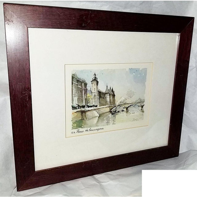 This 1950s Paris print of a watercolor of Isle de la Cite' originated from the sidewalk sellers along the Seine in Paris,...