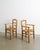 A rare and rustic pair of french mid century wooden armchairs in stained elm with decorative matching straw seats produced...