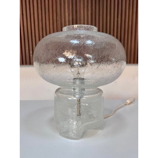 Sculptural, mouth-blown table lamp from the Süssmuth glassworks, crafted in the 1960s. The shade, made of textured frosted...