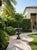 Classic Neoclassical Cast Iron Garden Urn With Distressed Bronze Finish For Sale - Image 11 of 12