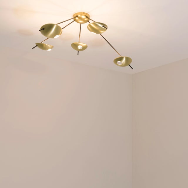 The Helios Quinque II Ceiling Light brings elegance to midcentury design through the inspiration of Italian design -...