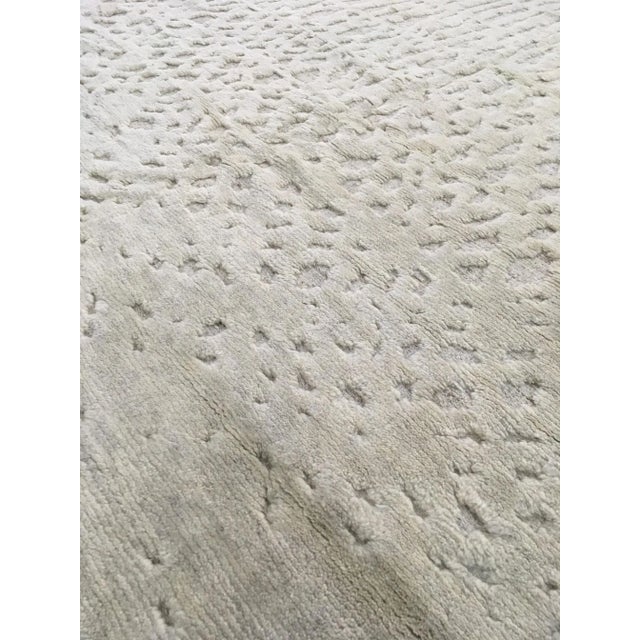 Beautiful hand knotted modern rug. Made of 75% wool and 25% cotton with very modern design and colors, this extremely...