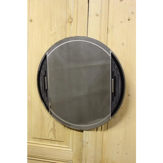 Round mirror of Art Deco vintage, acidian geometric decor on a dark background, rectangular support in nickel -plated...
