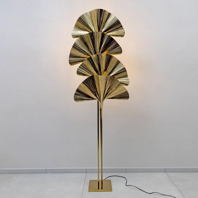 An elegant Italian floor lamp inspired by the iconic Ginkgo leaf motif, crafted from polished brass. The sculptural...
