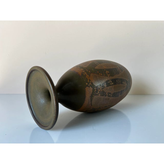 This is a beautiful mid-century stoneware designs west vase with abstract design. Has an impressed "Designs West 76"....