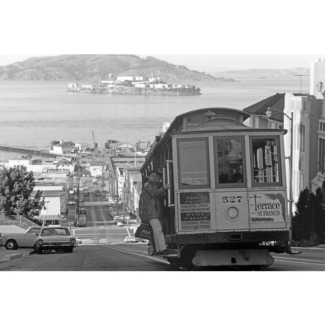 This black-and-white photograph captures the classic charm of San Francisco’s iconic cable cars. Taken in the 1960s, the...