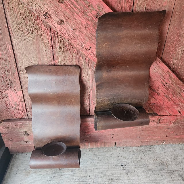 Add rustic charm to your space with this pair of vintage Mexican metal wall candle sconces. Each sconce measures 16 inches...