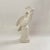 Vintage White Glazed Ceramic Sculpture of a Parrot sitting on a pedestal