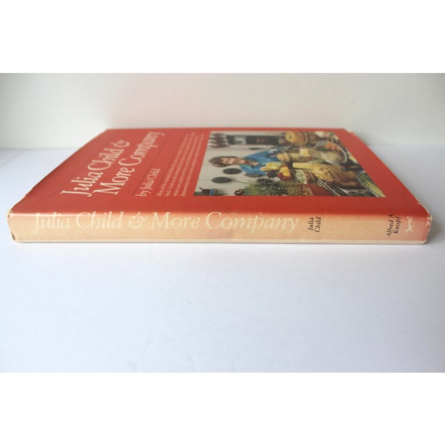 1981 Julia Child & More Company. Hardcover, with dust jacket. Good vintage condition with some wear and fading (especially...