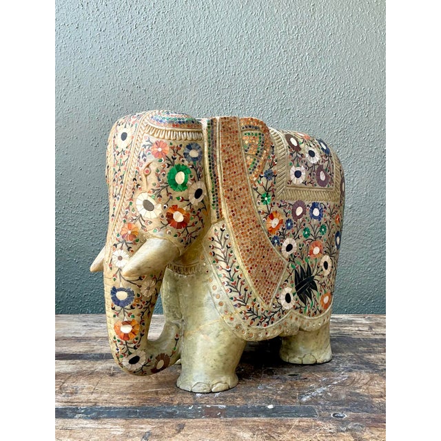 This magnificent hand-carved elephant sculpture is a masterwork of traditional Indian craftsmanship, specifically...