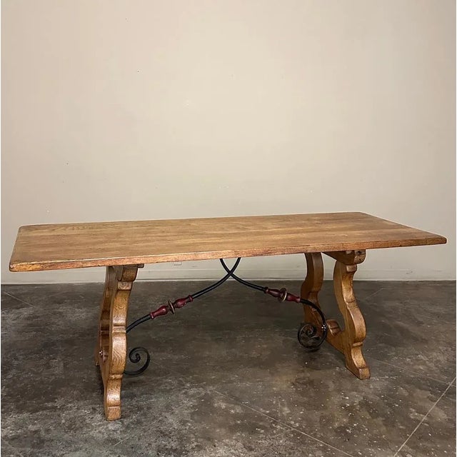 Antique Spanish Oak Dining Table was styled in the traditional manner which has been refined over the past several...