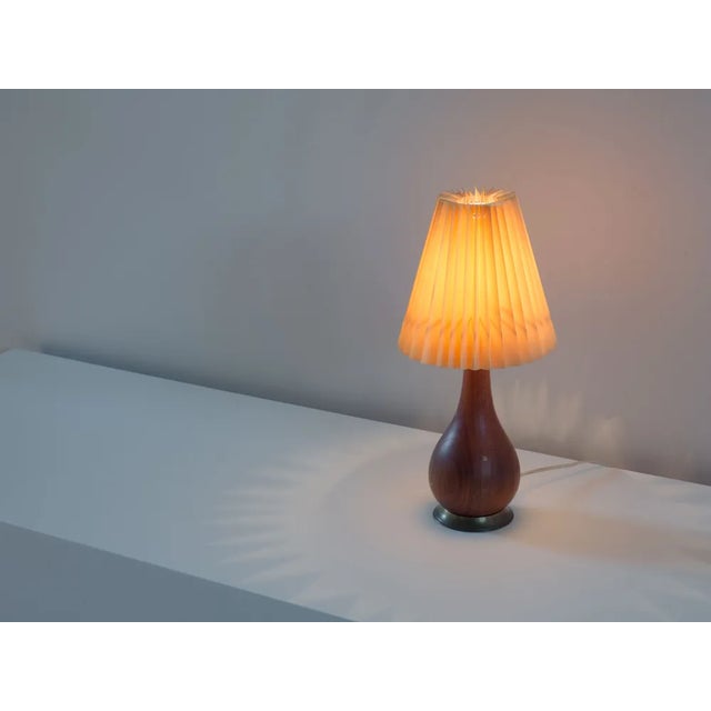 Danish design table lamp from the 1950s, designer and manufacturer unknown. This elegant table lamp is made from a solid...