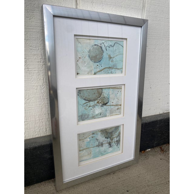 Single silver leaf frame housing three individual original mixed media paintings on heavy paper. These could certainly be...