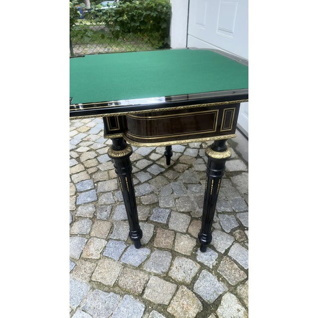 Impressive gaming table with inlays on the tabletop and especially on the panels, beautifully inlaid brass threads,...
