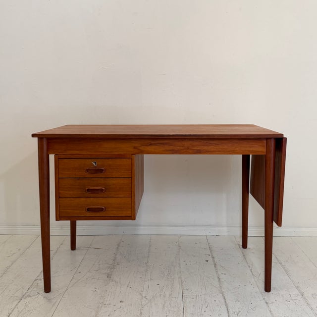 Designed by Arne Vodder and produced in Denmark during the 1960s, this elegant teak writing desk is a fine example of...