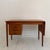 Designed by Arne Vodder and produced in Denmark during the 1960s, this elegant teak writing desk is a fine example of...