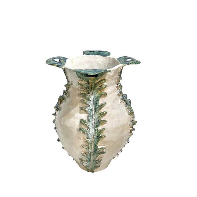 A striking unsigned vintage Italian tin glazed earthenware vase featuring an organic sculptural silhouette with stylized...