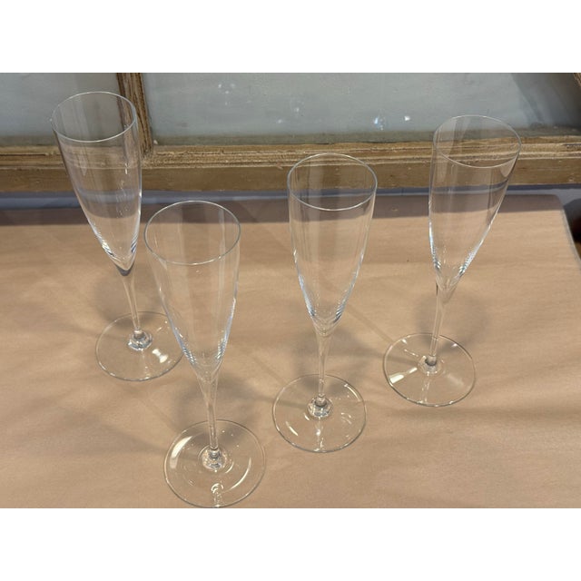 This is a set of four vintage Baccarat Dom Perignon champagne flute glasses. It is a set of four. They are crafted in...
