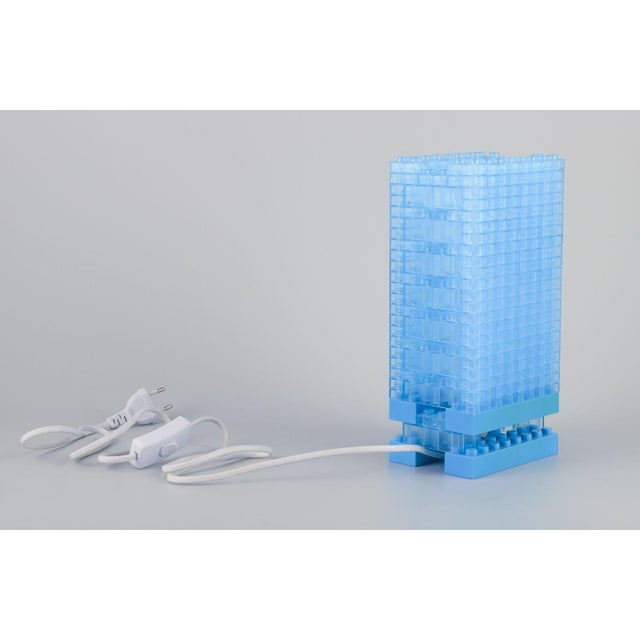 Scandinavian design. Table lamp in light blue plastic. Plastic blocks in Lego style. Late 20th century. In excellent...