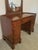 Gorgeous walnut vanity with mirror in excellent condition. Made by the Davis Cabinet Co. in Nashville, Tennessee in 1941....