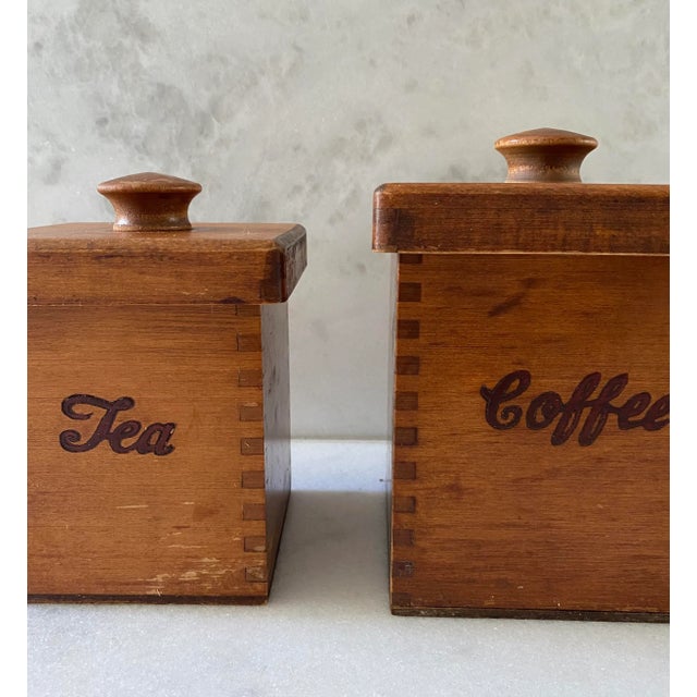 Set of two lidded wood Coffee and Tea canister set with handmade finger jointed construction. Unmarked, but likely made b...
