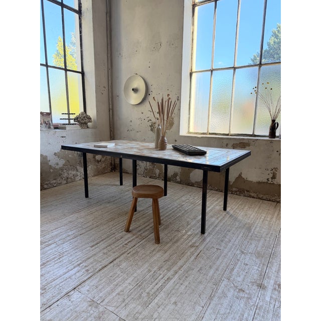Vintage dining table with a metal frame and tiled top dating from the 1950s. This table, with its high-quality...