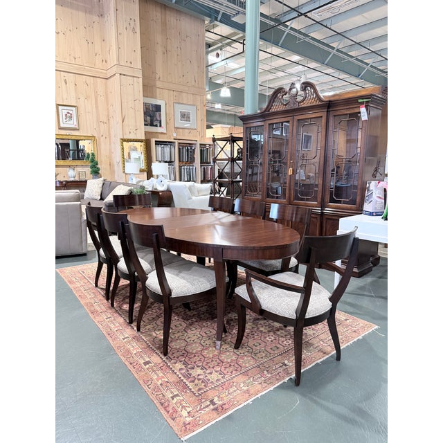 A sophisticated Ethan Allen Hathaway dining set showcasing rich zebrawood veneer paired with Indonesian mahogany solids in...