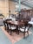 A sophisticated Ethan Allen Hathaway dining set showcasing rich zebrawood veneer paired with Indonesian mahogany solids in...