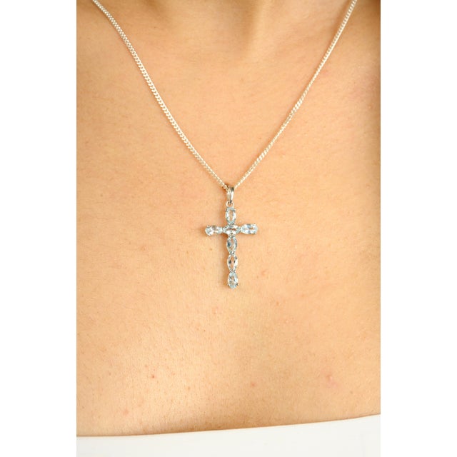 Dainty Unisex 1.29 CTW Aquamarine Cross Pendant Made in 14k Solid Yellow Gold. This stunning piece of jewelry instantly...