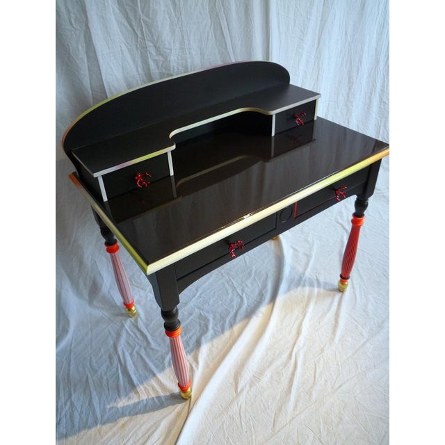 Pretty desk with 2 large drawers and 2 smaller ones on top Varnished PU lacquer Leaf gilding on the balls of the feet...