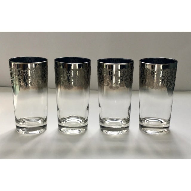 An interesting example of mid century silver trimmed glass featuring a scrollwork pattern in a textured frost.