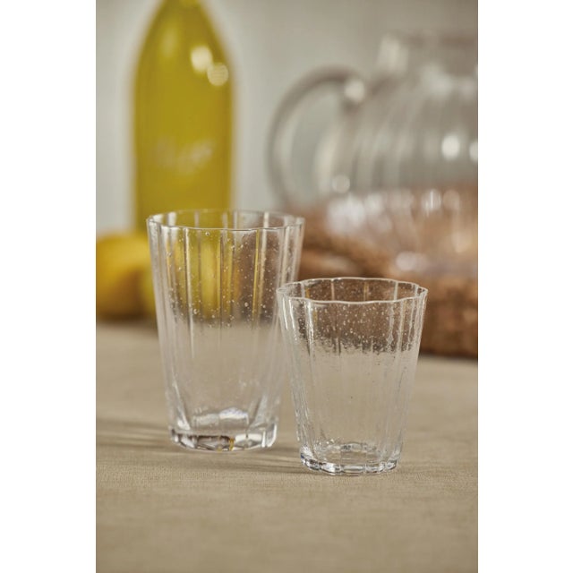 Add a touch of sophistication to your next gathering with this set of highball glasses. The internal bubbling and ribbed...