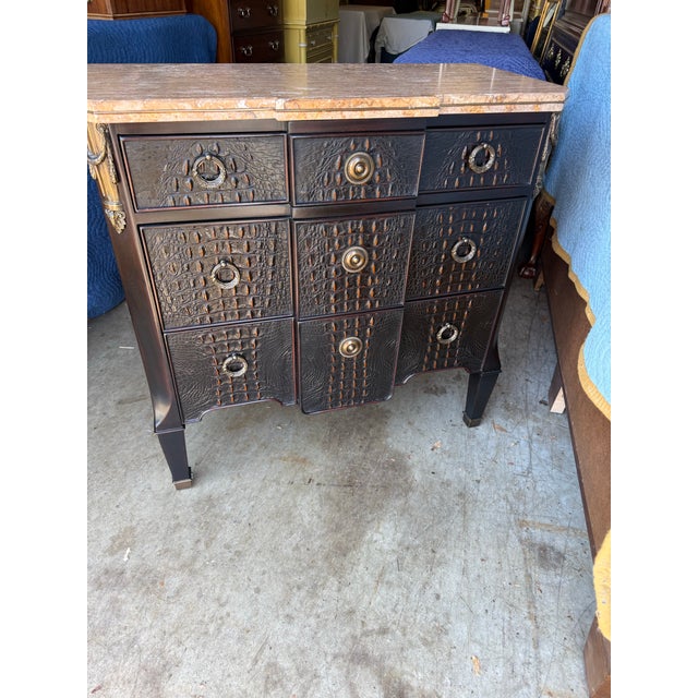 This extraordinary Theodore Alexander chest that combines luxury, craftsmanship, and distinctive design. Finished in a...