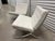 Pair of Knoll white leather Barcelona chairs with chrome base.