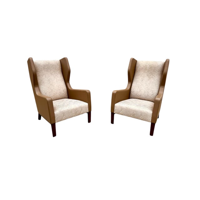 A pair of wingback chairs and ottoman from covetable designer Holly Hunt. The Darder wingback chair pays homage to the...
