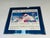 These pictures do not do this justice. This is a serigraph with an exquisite, foil wrapped frame. I found this at an...